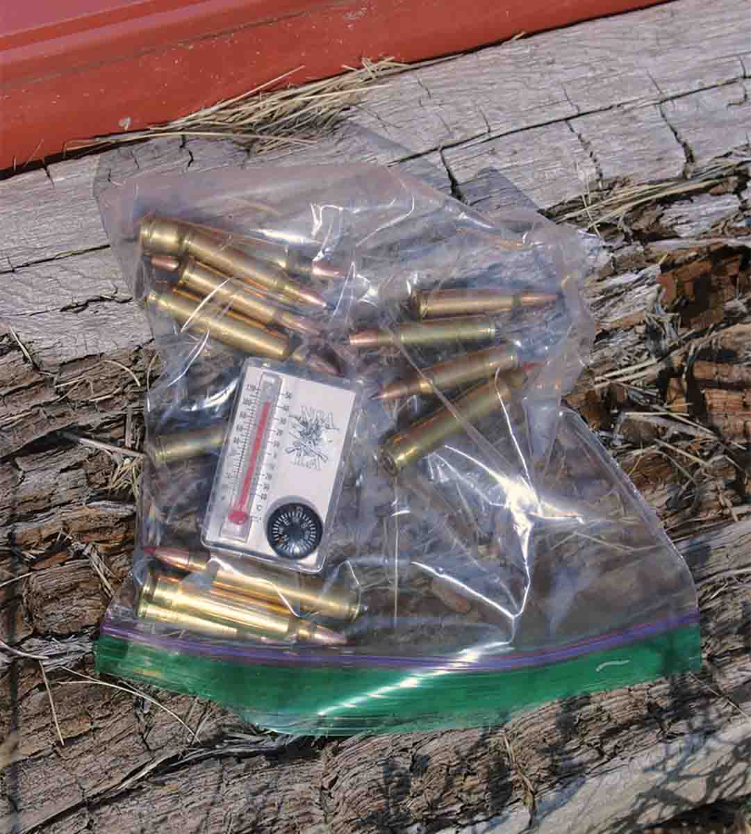 Test ammunition can be heated by putting it in a transparent plastic bag in the sun, along with a small thermometer to determine when it’s toasty. This bag was heated by the sun to 115 degrees within a few minutes.